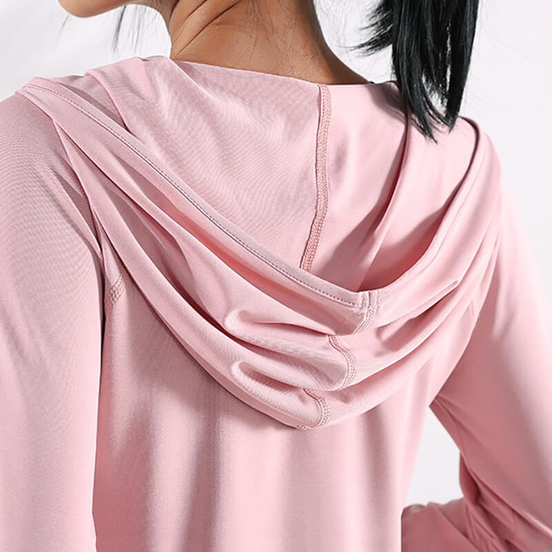 Back view of pink sports loose hooded sweatshirt for women, showcasing breathable and lightweight fabric. Ideal for fitness and yoga.